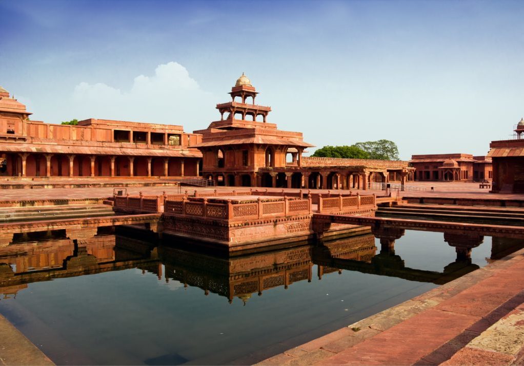 Fatehpur Sikri mirrored in a water pool in India